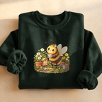 Cozy Garden Bee Sweatshirt, bumblebee having tea in a flower garden, for gardeners and bee lovers