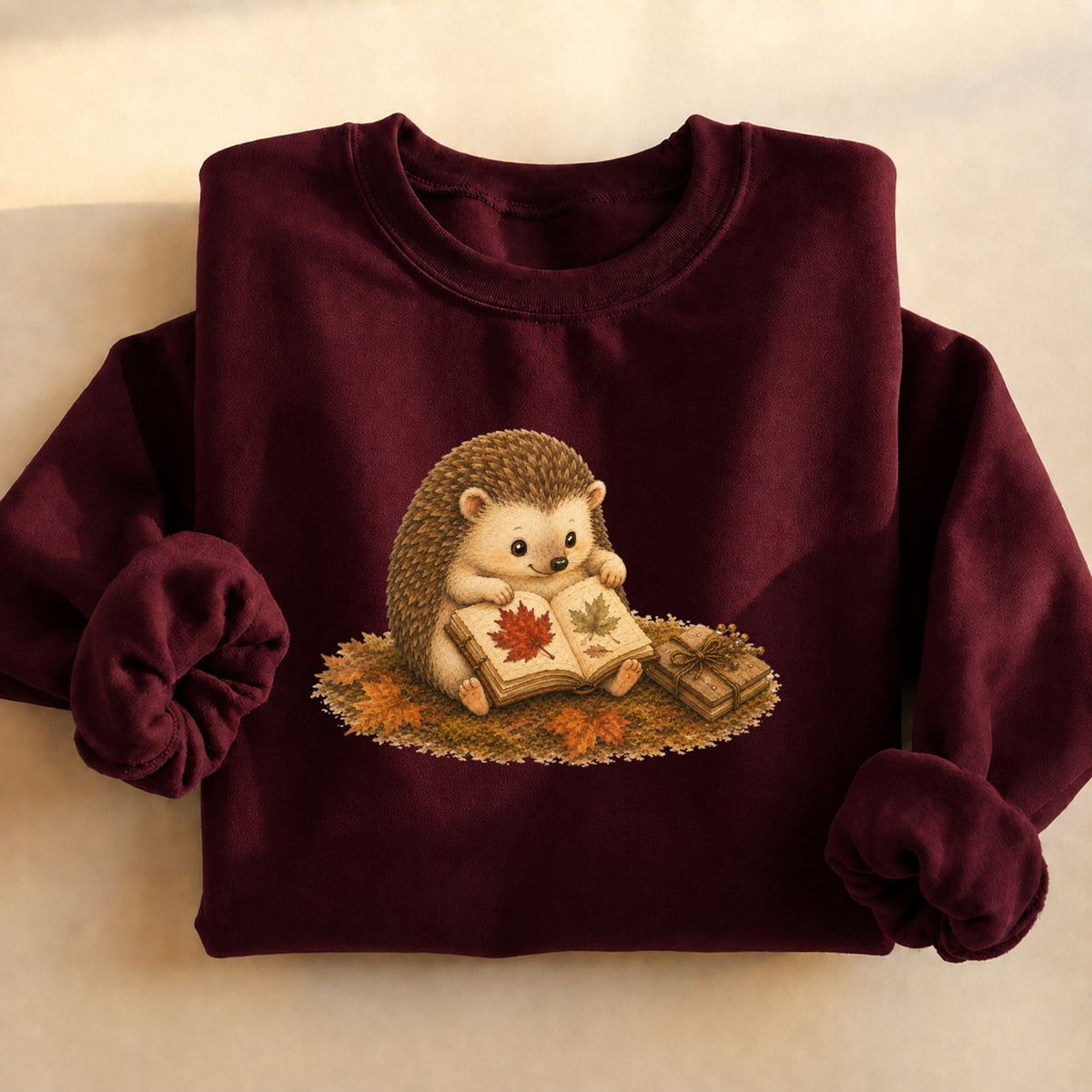Autumn hedgehog reading sweatshirt in maroon