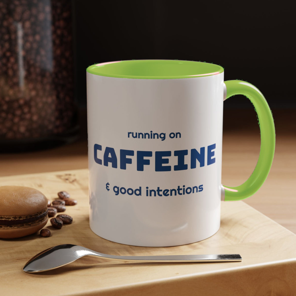 Caffeine and Good Intentions mug, blue lettering, light green handle, 11oz