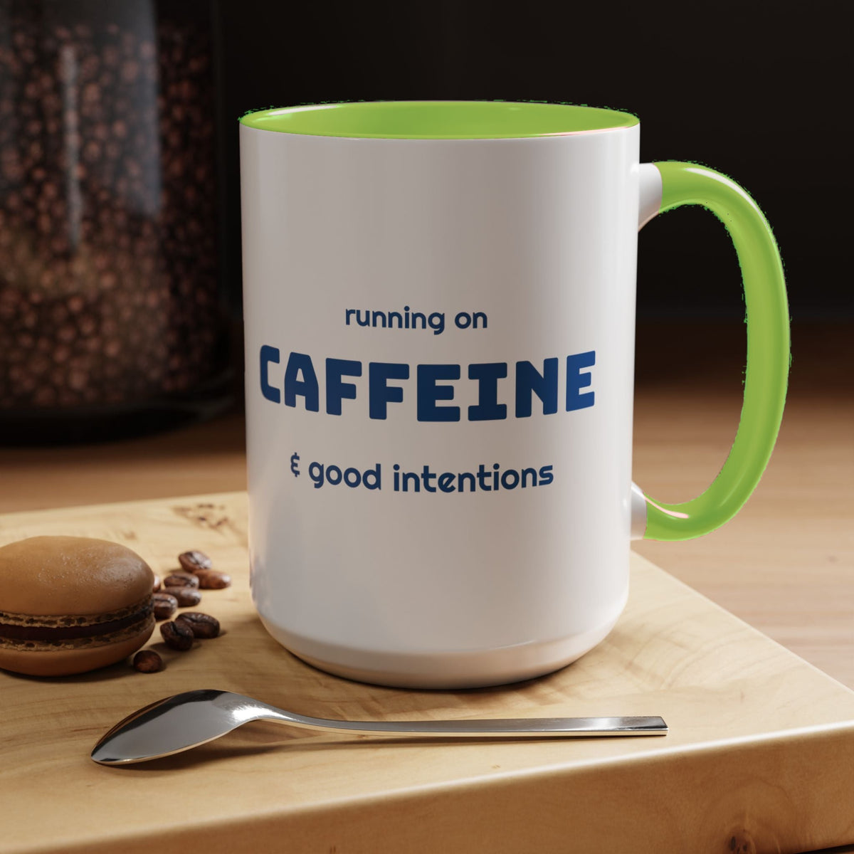 Caffeine and Good Intentions mug, blue lettering, light green handle, 15oz