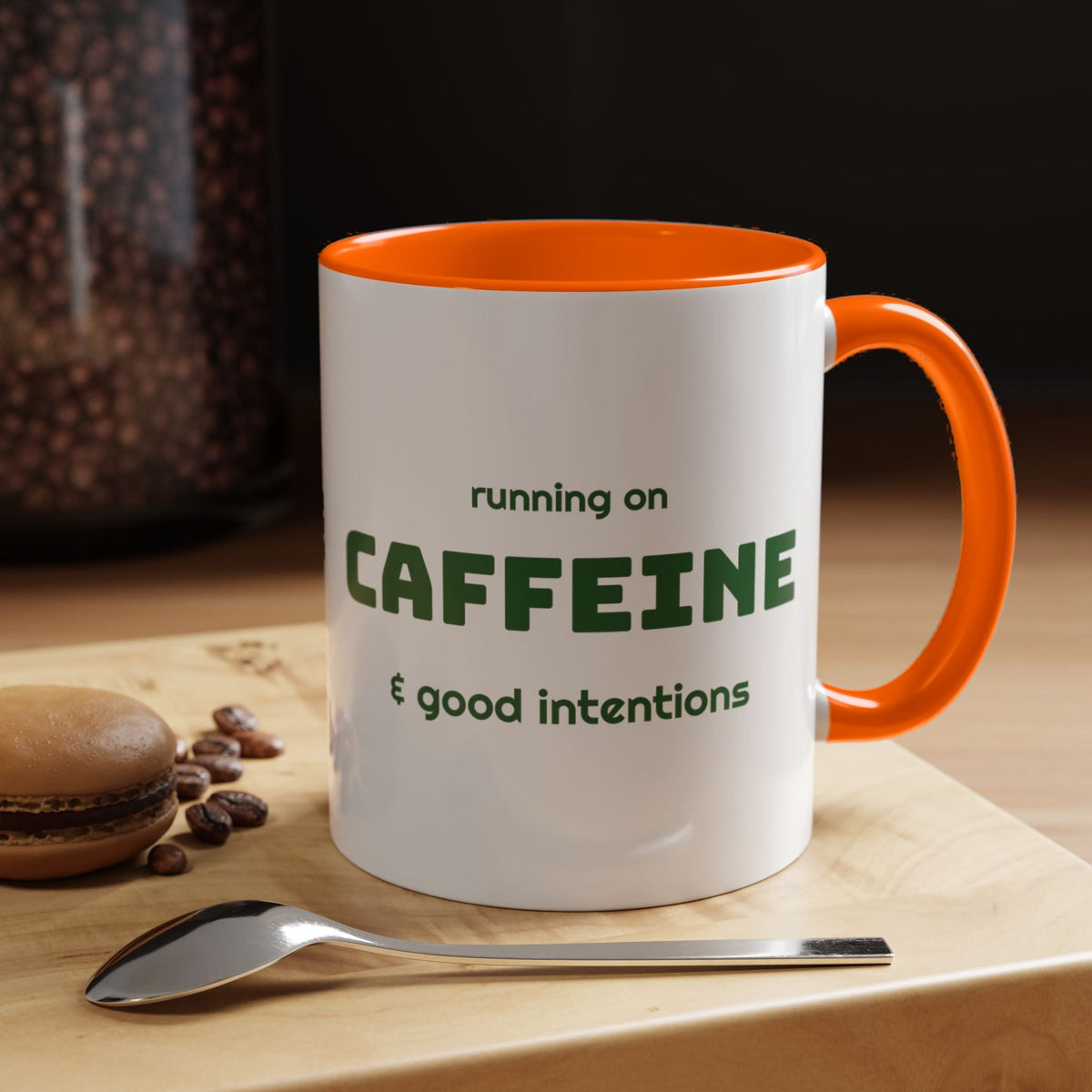 Caffeine and Good Intentions mug, green lettering, orange handle, 11oz