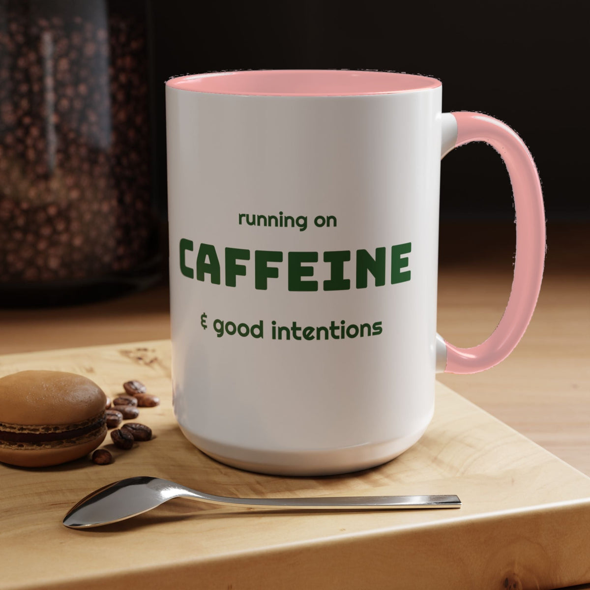 Caffeine and Good Intentions mug, green lettering, pink handle, 15oz